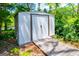Backyard storage shed with a ramp for easy access, offering ample space for tools and equipment at 527 W Church St, Villa Rica, GA 30180