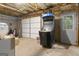 Spacious basement featuring a garage door and an arcade machine, offering versatile space for storage or recreation at 119 Crown Springs Dr, Mcdonough, GA 30252