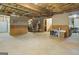 Unfinished basement with exposed ceiling, concrete floor, and open layout offering customization options at 119 Crown Springs Dr, Mcdonough, GA 30252