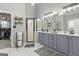 Updated bathroom featuring double vanity, modern fixtures, and tiled floors, exudes cleanliness at 119 Crown Springs Dr, Mcdonough, GA 30252