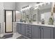 Bright bathroom featuring double vanity, and tiled floors, exudes cleanliness at 119 Crown Springs Dr, Mcdonough, GA 30252