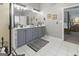 Updated bathroom featuring double vanity, modern fixtures, and tiled floors, exudes cleanliness at 119 Crown Springs Dr, Mcdonough, GA 30252