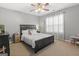 Bedroom featuring carpet, a ceiling fan, curtains, and a view to a play table at 119 Crown Springs Dr, Mcdonough, GA 30252