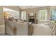 Inviting living room featuring a stone fireplace and plush beige carpeting and comfortable couches at 119 Crown Springs Dr, Mcdonough, GA 30252