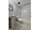 A clean bathroom featuring a pedestal sink, toilet, and a shower with a sliding glass door at 105 Harris Ct, Stockbridge, GA 30281