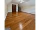 This bedroom features hardwood floors, neutral walls, vaulted ceilings and a ceiling fan at 105 Harris Ct, Stockbridge, GA 30281