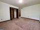 Bedroom featuring neutral carpet, closet, and natural light from a window at 105 Harris Ct, Stockbridge, GA 30281