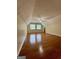 This bedroom features hardwood floors, vaulted ceilings and two windows allowing natural light in at 105 Harris Ct, Stockbridge, GA 30281