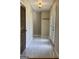 Bright foyer with tiled floors, coat closet, and a view of the front door and entryway at 105 Harris Ct, Stockbridge, GA 30281
