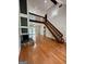 Inviting living room with gleaming hardwood floors, fireplace, and an open staircase to the loft at 105 Harris Ct, Stockbridge, GA 30281