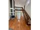 Bright living room features hardwood floors, a cozy fireplace, and loft access with natural lighting at 105 Harris Ct, Stockbridge, GA 30281