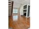 Hardwood floors, fireplace, and loft access featured in the home's living room at 105 Harris Ct, Stockbridge, GA 30281