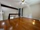 Cozy loft area featuring wood flooring, natural light, and staircase with railing at 105 Harris Ct, Stockbridge, GA 30281