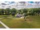 Aerial view of a large house with long driveway and large trees at 411 Hampton Rd, Fayetteville, GA 30215