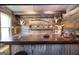 Rustic bar area featuring reclaimed wood, liquor display, and western decor at 411 Hampton Rd, Fayetteville, GA 30215