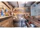 Detailed view of the rustic bar area with reclaimed wood and western-themed decor at 411 Hampton Rd, Fayetteville, GA 30215