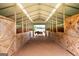 Interior view of horse barn with stalls and horse at 411 Hampton Rd, Fayetteville, GA 30215