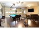 Large finished basement featuring a pool table, seating area, and garage door at 411 Hampton Rd, Fayetteville, GA 30215