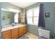 Bathroom featuring a large window and vanity, providing ample light and space at 411 Hampton Rd, Fayetteville, GA 30215