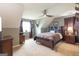 Bedroom with modern ceiling fan, neutral walls, and window with natural light at 411 Hampton Rd, Fayetteville, GA 30215
