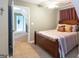 Bedroom features neutral walls, plush carpet, and traditional furnishings at 411 Hampton Rd, Fayetteville, GA 30215