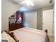 Bedroom features neutral walls, plush carpet, and a large closet at 411 Hampton Rd, Fayetteville, GA 30215