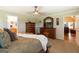 Bedroom with a large bed and matching furniture, and an attached bath at 411 Hampton Rd, Fayetteville, GA 30215