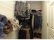 Organized walk-in closet with shelving, hanging racks, and ample storage for clothing and accessories at 411 Hampton Rd, Fayetteville, GA 30215