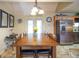 Dining room with wooden table, chairs, mirrors and chandelier lighting at 411 Hampton Rd, Fayetteville, GA 30215