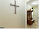 Hallway featuring a cross and doorway with a wooden bench and hooks at 411 Hampton Rd, Fayetteville, GA 30215