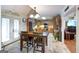 Bright kitchen featuring wooden cabinets, granite countertops, and a dining area at 411 Hampton Rd, Fayetteville, GA 30215