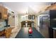 Bright kitchen with an island and stainless steel appliances with sight lines to dining area at 411 Hampton Rd, Fayetteville, GA 30215