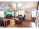 Spacious living room features hardwood floors, high ceilings, and leather furniture at 411 Hampton Rd, Fayetteville, GA 30215
