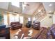Bright living room with hardwood floors, vaulted ceiling, and comfortable leather seating at 411 Hampton Rd, Fayetteville, GA 30215