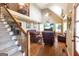 Inviting living room featuring hardwood floors, a cozy seating area, and a staircase with wrought iron railings at 411 Hampton Rd, Fayetteville, GA 30215