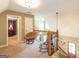 Bright carpeted loft area with decorative rocking chair and comfortable papasan chair at 411 Hampton Rd, Fayetteville, GA 30215