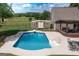 Backyard with in-ground pool, diving board, shed, deck and fenced in yard at 411 Hampton Rd, Fayetteville, GA 30215