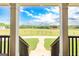 Breathtaking view from the porch looking out onto sprawling green pastures and a clear blue sky at 411 Hampton Rd, Fayetteville, GA 30215