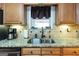 Kitchen sink with window and granite counter tops at 411 Hampton Rd, Fayetteville, GA 30215