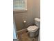 The bathroom has a standard toilet with tile floors and neutral wall paint at 2074 Ayers Creek Ct, Villa Rica, GA 30180