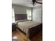 A spacious bedroom is shown with wood flooring and a ceiling fan at 2074 Ayers Creek Ct, Villa Rica, GA 30180