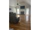 Spacious living room with hardwood floors, fireplace, and a ceiling fan at 2074 Ayers Creek Ct, Villa Rica, GA 30180