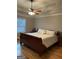 Spacious main bedroom with hardwood floors, a large bed, and natural light at 2074 Ayers Creek Ct, Villa Rica, GA 30180