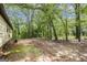 Backyard showing the exterior of the home and wooded area at 6109 Oakwood Sw Cir, Covington, GA 30014