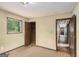 Bedroom with closet, open door and window providing natural light at 6109 Oakwood Sw Cir, Covington, GA 30014