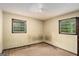 The bedroom features dual windows and an electrical outlet on the wall at 6109 Oakwood Sw Cir, Covington, GA 30014