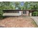 Modest single-story home with a carport and a partially brick facade at 6109 Oakwood Sw Cir, Covington, GA 30014