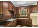 A functional kitchen featuring dual sinks and natural light at 6109 Oakwood Sw Cir, Covington, GA 30014