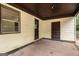 Covered patio showing the back door, window, and side door at 6109 Oakwood Sw Cir, Covington, GA 30014