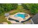 Aerial view of the pool, gazebo, outdoor kitchen, and landscaped backyard at 1212 Lee Whatley Dr, Lithonia, GA 30058